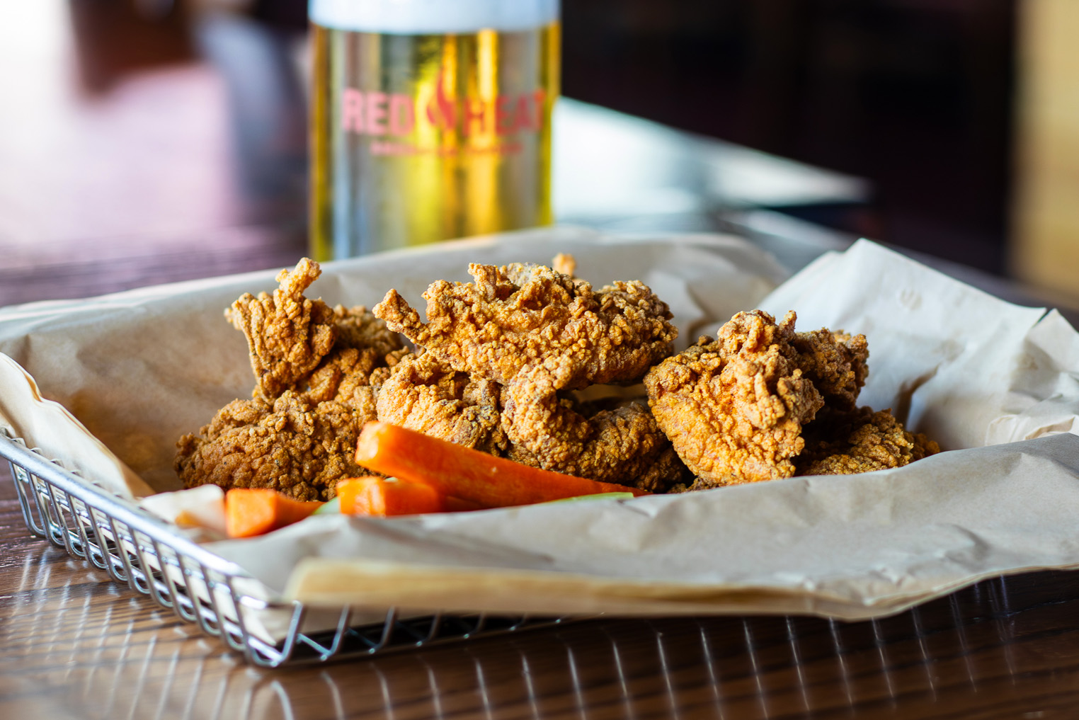Boneless chicken tenders with a side of carrots