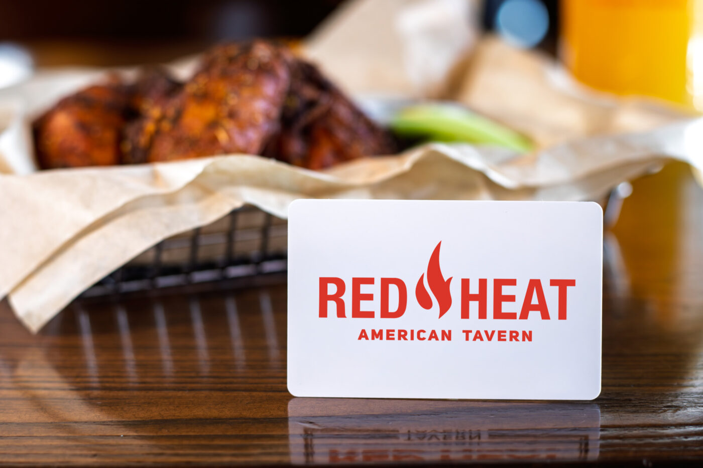 Red Heat gift card with wings and a side of celery in the background