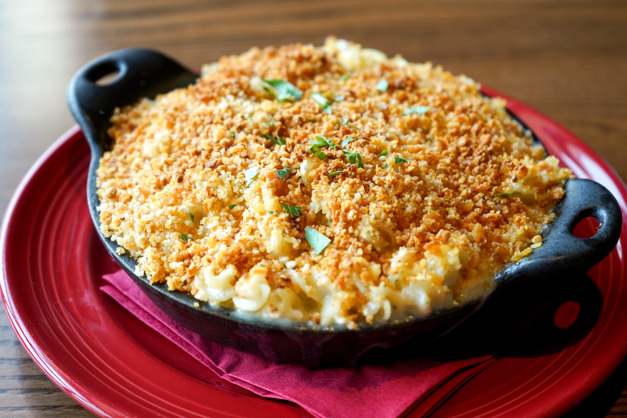 Gluten free mac & cheese served on a red plate.