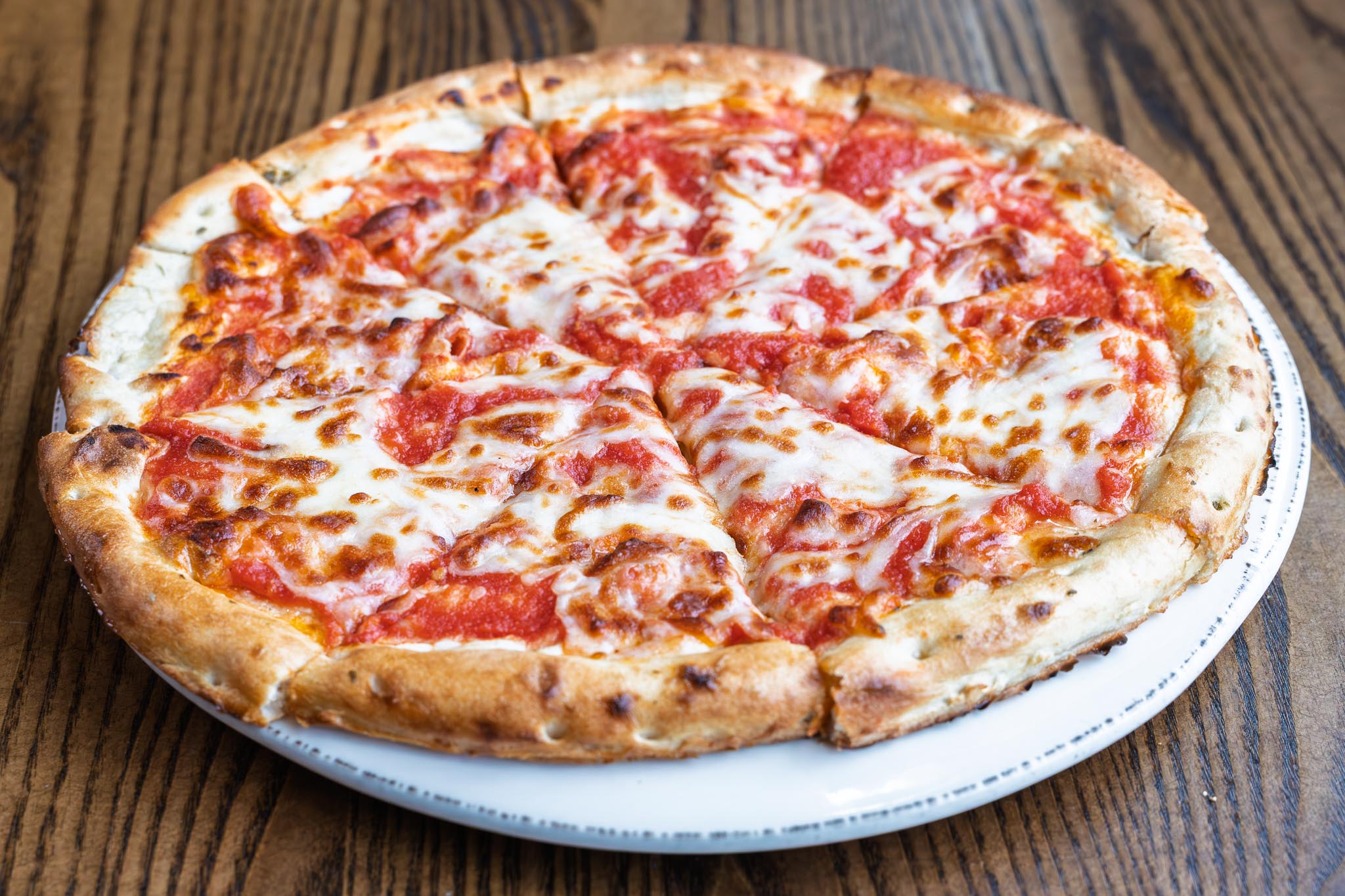 Classic cheese pizza made with house-made tomato sauce. Gluten free crust available on request.